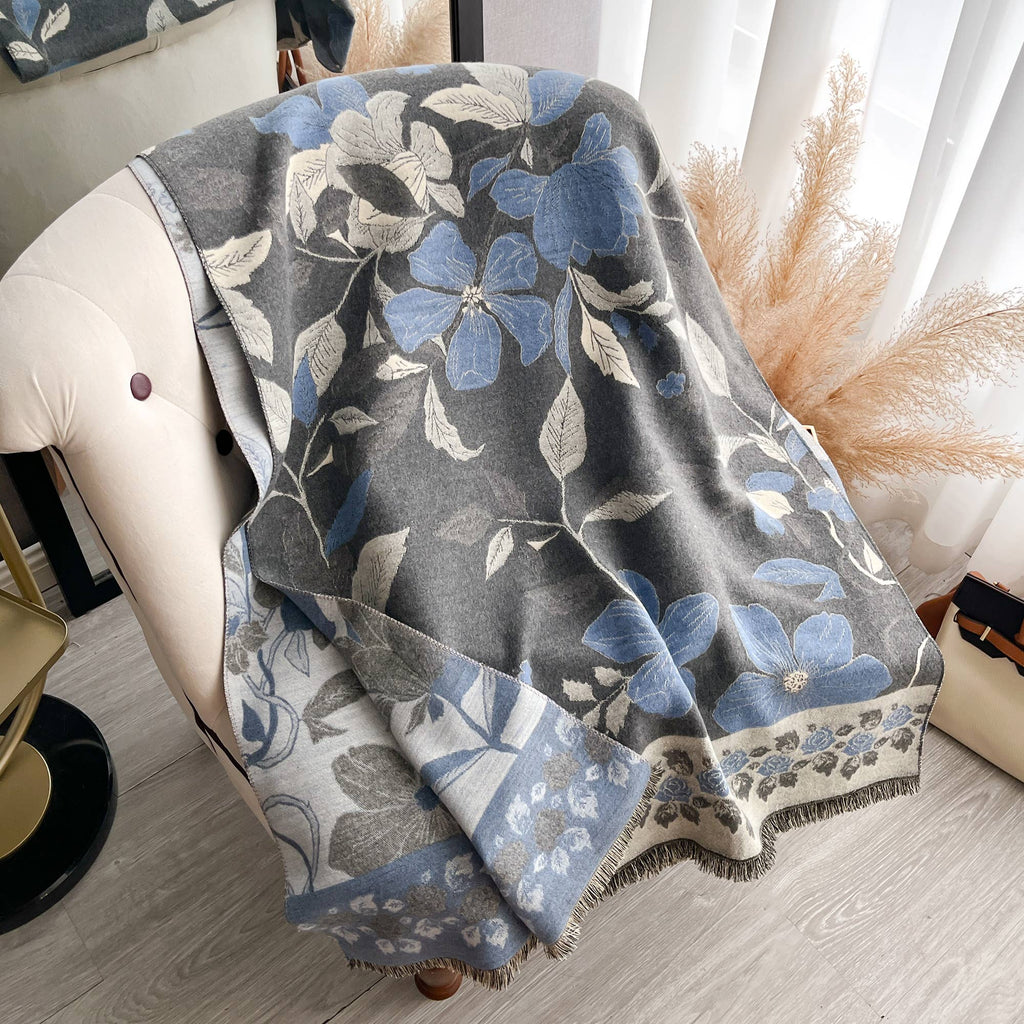Floral patterned blanket draped over a chair in a home setting